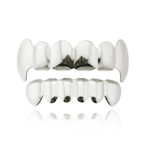 Detailed view of hip hop silver teeth grillz set with mirror polished metallic finish