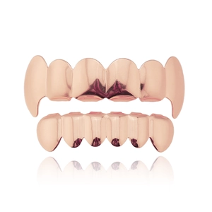 Front close-up of rose gold plated hip-hop dental grills with polished metal finish