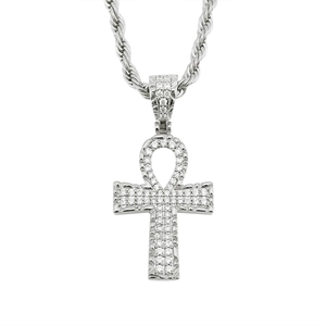 Macro detail of silver Ankh cross pendant with sparkling cubic zirconia on a rope chain