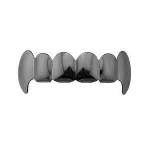 Macro view of gunmetal 6-teeth vampire fangs grillz with reflective mirror finish