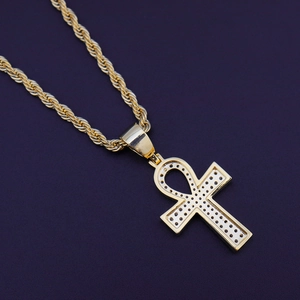 Detail of gold-plated Ankh cross pendant with micro-inset zircons on rope chain