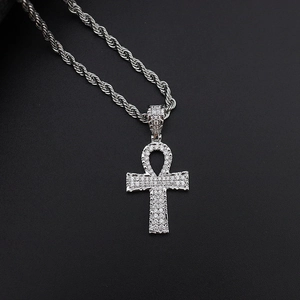 Detailed macro view of silver Ankh cross pendant with micro-paved cubic zirconia stones