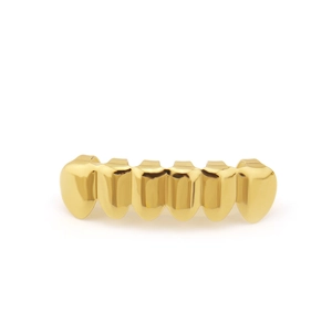 Detailed macro view of mirror-polished golden six-tooth hip hop grillz accessory