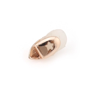 Hip hop style single gold tooth grillz featuring a hollow star design and metal finish