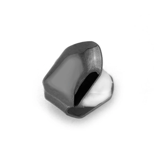 Macro shot of silver hip hop grillz with white silicone molding bar for single tooth