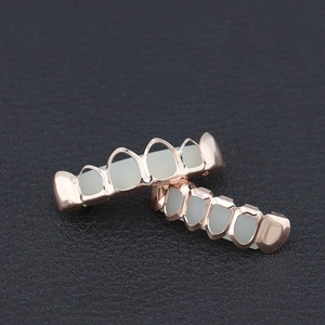 Set de grillz hip hop huecos chapados en oro rosa para decoración dental superior