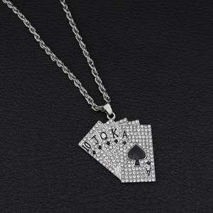 Macro view of iced out royal flush poker pendant with crystal rhinestones and twisted chain
