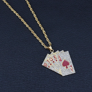 Close-up of hip hop pendant with sparkling rhinestones and royal flush poker cards