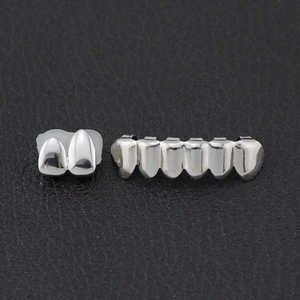 Polished silver hip hop grillz set featuring top two-tooth and bottom six-tooth pieces