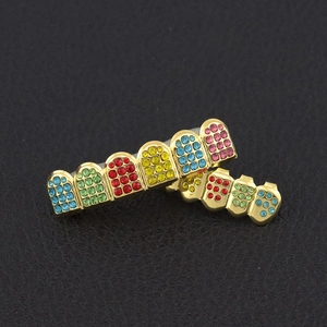 Hip hop teeth grills set with colorful rhinestones on gold plated base in main view