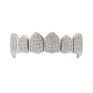 Macro shot of silver hip hop grillz featuring micro-paved cubic zirconia stones