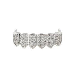 Macro detail of silver hip hop grillz with 6-tooth design and micro-pave white zircons
