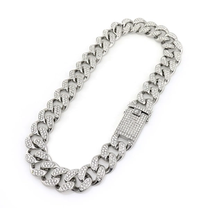 Macro shot of 20mm iced out Cuban link chain necklace with silver pave crystals