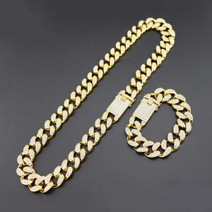 Chunky gold-plated iced out Cuban link chain and bracelet set with sparkling diamonds