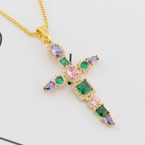 Close-up of gold-plated cross pendant featuring vibrant colorful zircon stones
