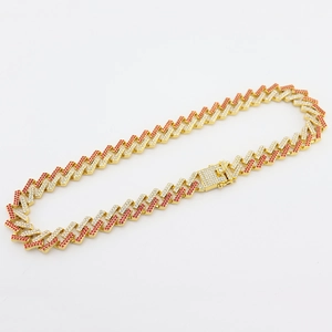 Detail shot of 15mm Miami Cuban link necklace with red and clear inlaid zircons