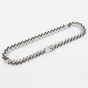 Close-up of 15mm Miami Cuban link chain with black and white pavé cubic zirconia
