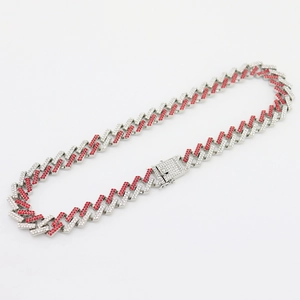 Close-up of 15mm Miami Cuban link chain with red and white zircon pavé in silver finish