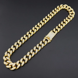 Close-up of 20mm gold-plated hip hop Cuban chain with sparkling pave-set diamonds
