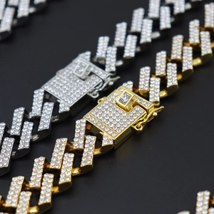 Macro detail of 15mm Miami Cuban link necklace with iced out rhinestones and secure clasp