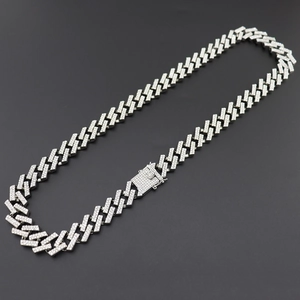 Detail of 15mm silver Cuban link necklace featuring micro-pave white round rhinestones