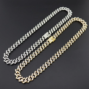 Detailed macro view of 15mm gold and silver iced-out cuban chains with secure box clasp
