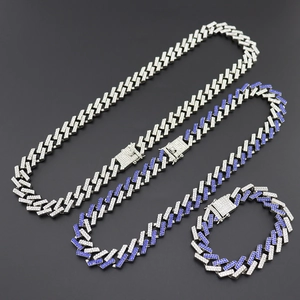 Close-up of hip hop silver Cuban chain necklace set with white and blue cubic zirconia