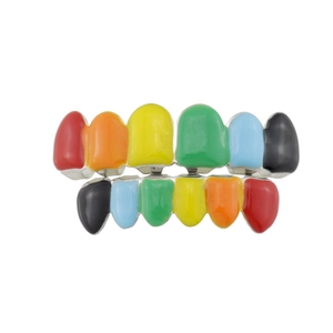 Macro view of multi-color rainbow hip hop tooth grills with gold plating and glossy finish