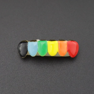 Macro view of rainbow enamel hip hop grillz showing six colorful teeth with gold plating