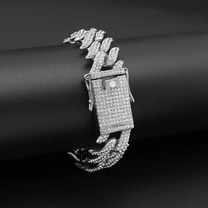 Close-up of iced out cuban link bracelet with sparkling stones on black display stand