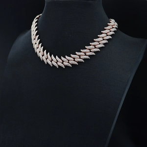 Close-up of 19mm rose gold Cuban link necklace with thorns and micro-paved rhinestones