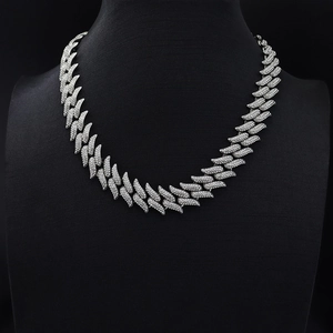 Macro detail of 19mm silver hip-hop thorn Cuban chain with sparkling pave crystals