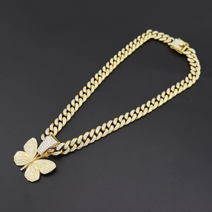 Iced out hip hop cuban link chain with large butterfly pendant in gold finish