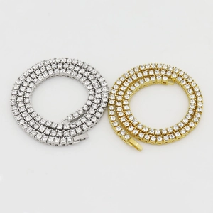 Classic tennis chain necklace set with silver and gold finishes featuring round cubic zirconia