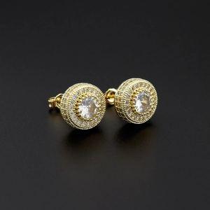Macro side view of gold hip-hop stud earrings with micro-paved crystals and halo design