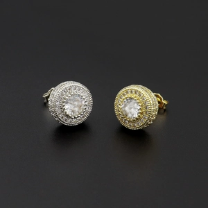 Detailed close-up of iced-out hip hop stud earrings in gold and silver finish with zircon