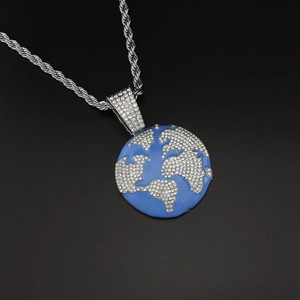 Detailed view of hip hop world map pendant with blue enamel and sparkling rhinestones