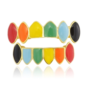 Macro view of colorful enamel plated teeth grillz set with a gold finished finish