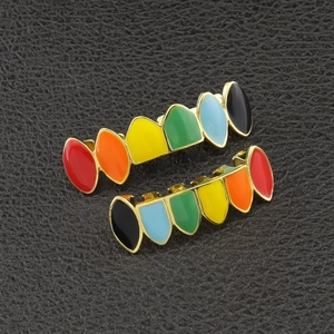 Rainbow gradient gold teeth grills set in hip hop style on black leather background