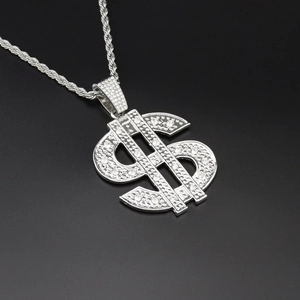 Detailed macro view of silver dollar sign pendant featuring full crystal inlay on rope chain