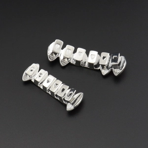 Silver hip hop teeth grills set with unique hollow heart design and polished finish