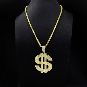 Detailed view of hip hop dollar sign pendant with sparkling rhinestones on rope chain