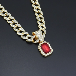 Close-up of hip hop cuban link chain featuring a large rectangular red ruby pendant