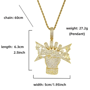 Macro shot of hip hop pendant with cubic zirconia, featuring dimension and weight labels