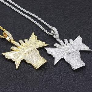 Iced out hip hop necklace with fist and dollar pendant in gold and silver finish