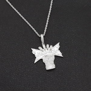 Macro shot of silver hip hop pendant with Really Rich lettering and iced-out zircon stones