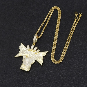 Detailed close-up of Really Rich iced out fist pendant with white cubic zirconia stones