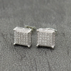 Close-up of square iced-out micro-pave zircon stud earrings in silver-tone metal