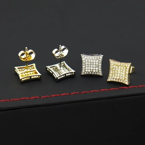 Detail of square hip hop stud earrings showing gold and silver finishes with pavé zircons