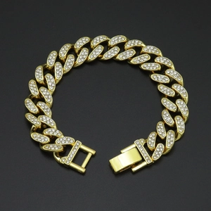 Macro shot of 12mm gold Cuban link bracelet with iced-out pave rhinestones and clasp detail